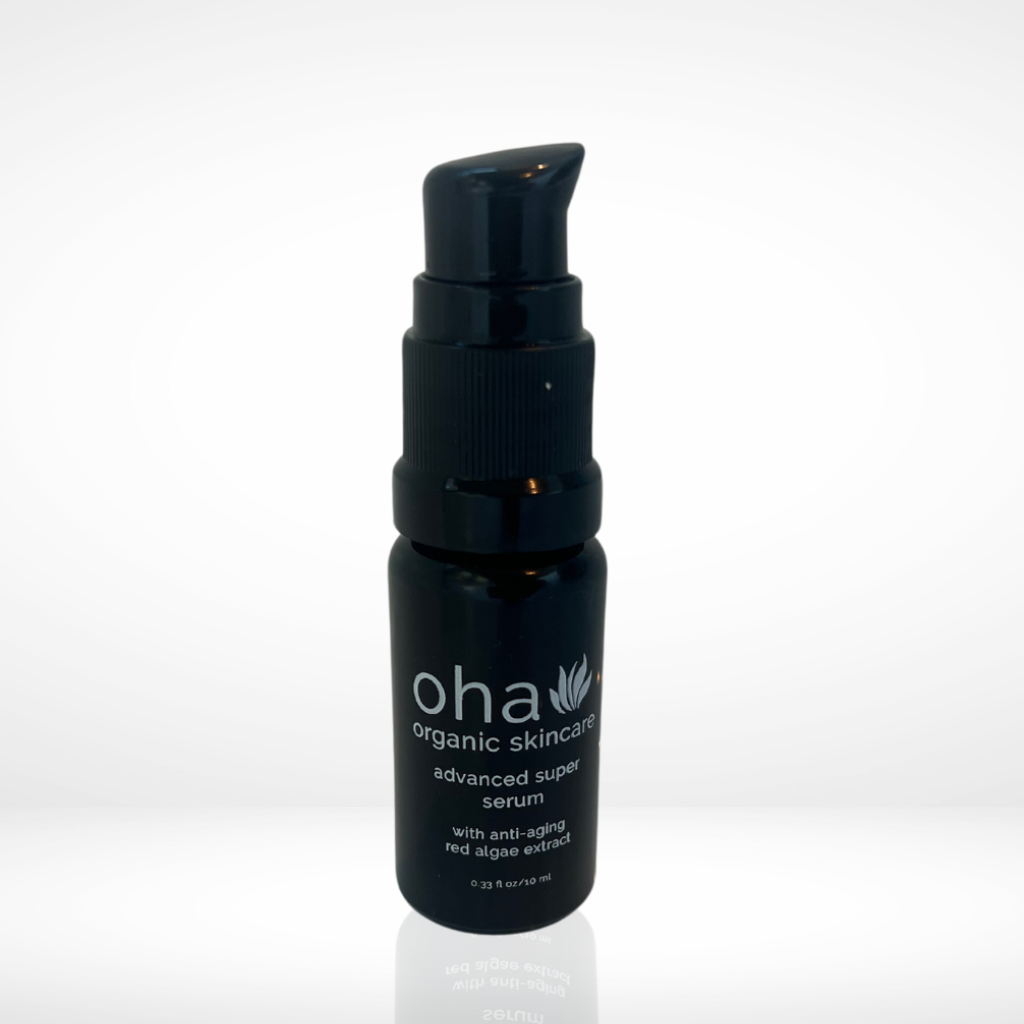 Potent anti-aging serum in black glass pump bottle