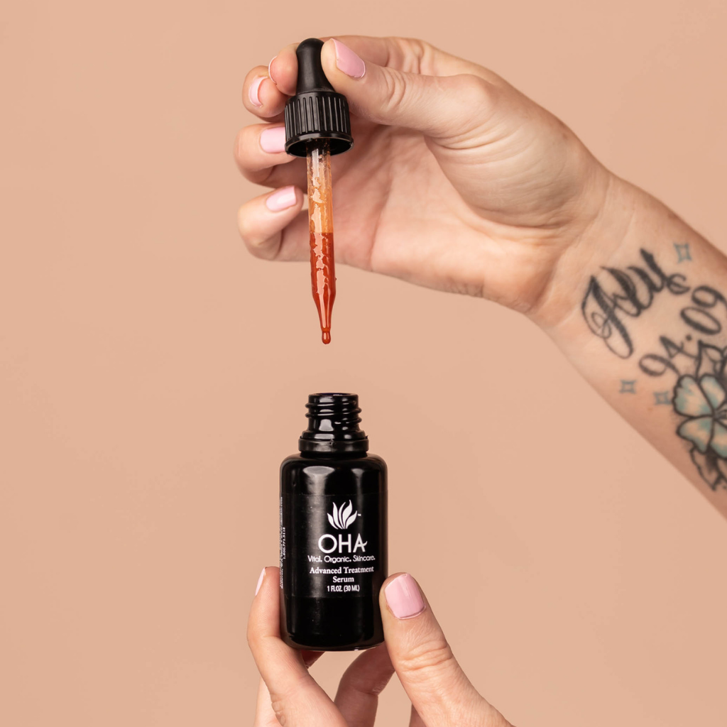 Potent anti-aging serum in black glass pump bottle