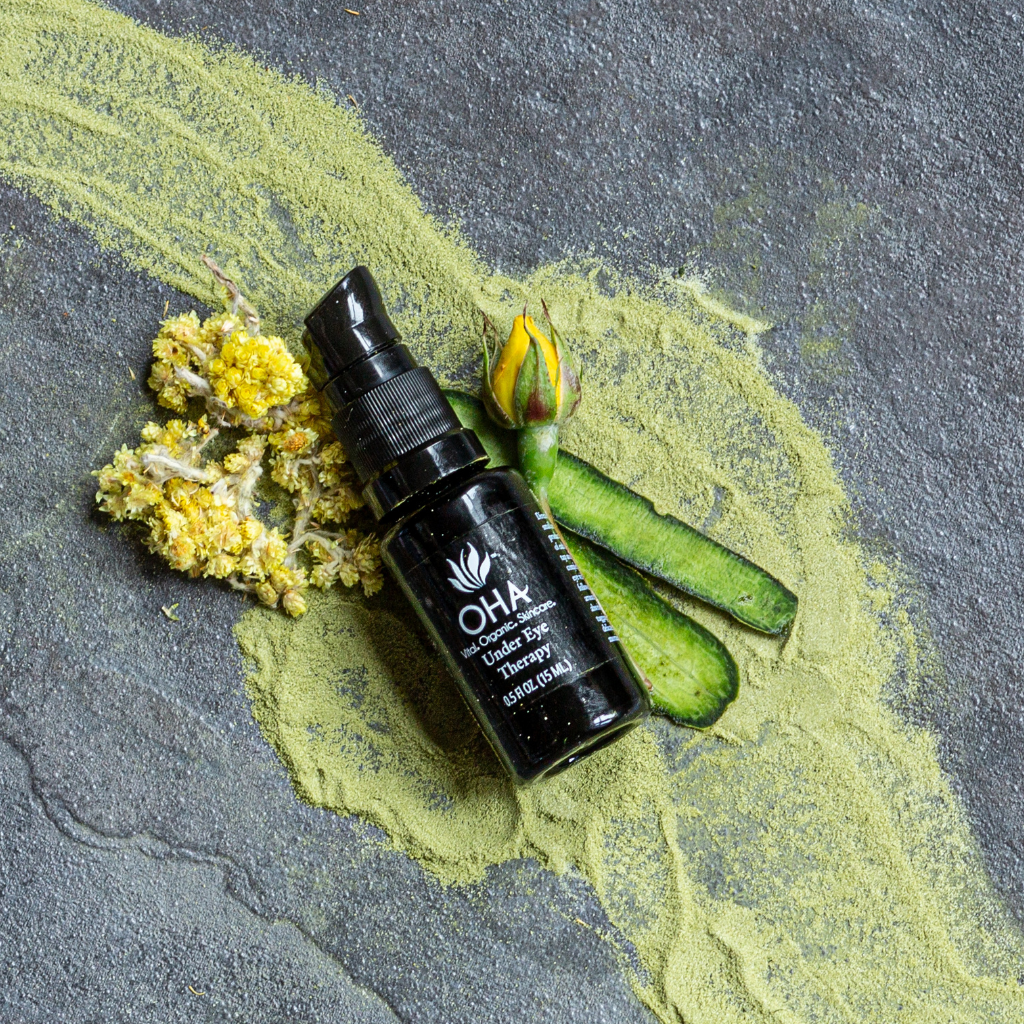 Organic under eye cream with white and green tea in a glass bottle