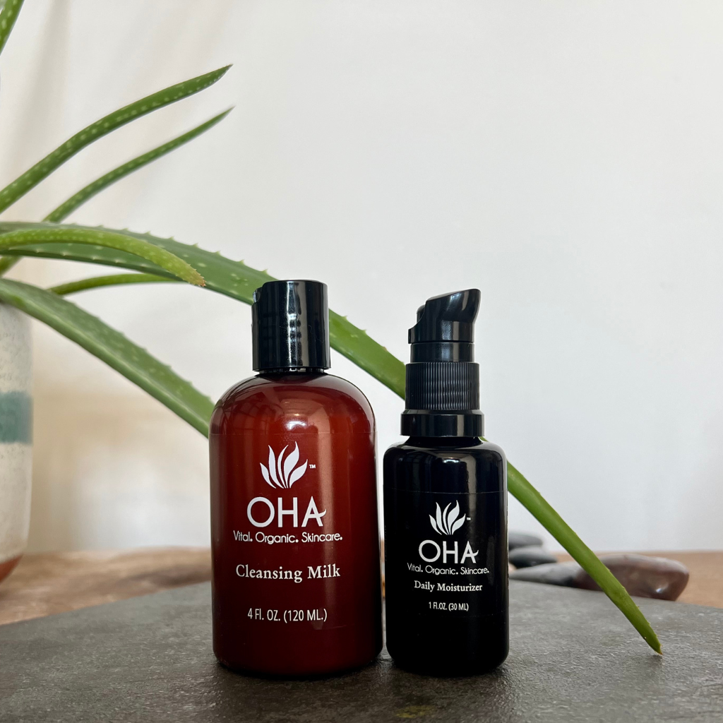 organic cleansing milk and bottle of daily moisturizer