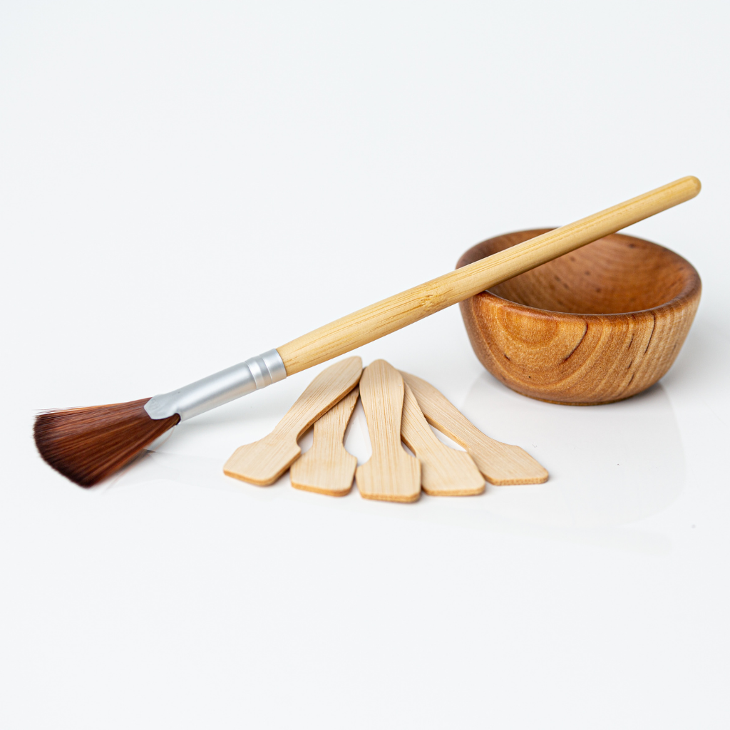 Bamboo skincare applicator with facial fan brush and wooden skincare mixing bowl
