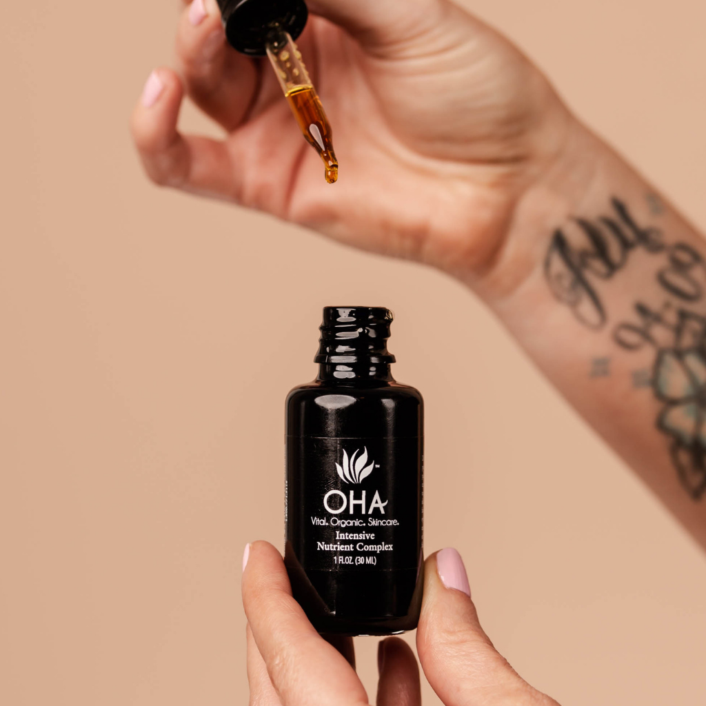 Organic anti-aging recovery serum in a glass bottle