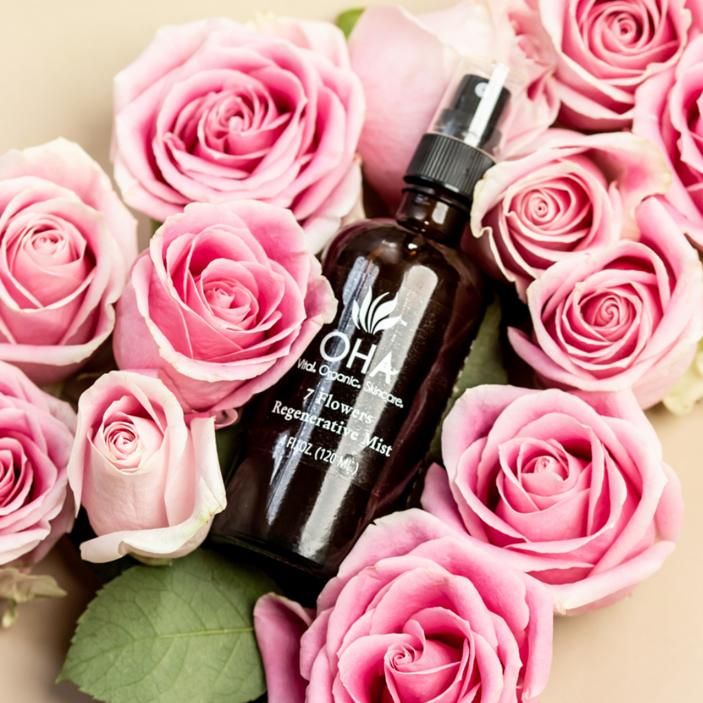 Calming floral infused facial mist surrounded by pink roses