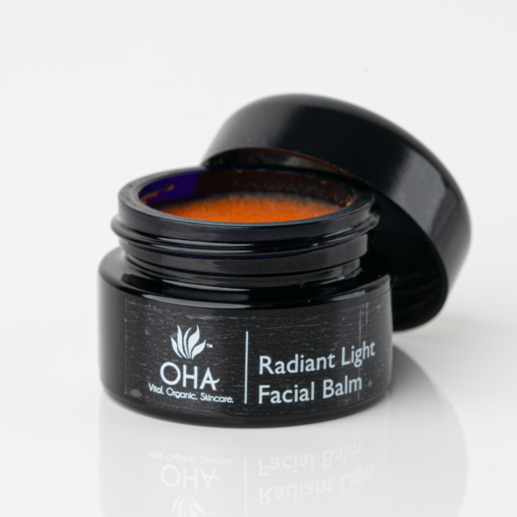 Orange hydrating facial balm in black jar